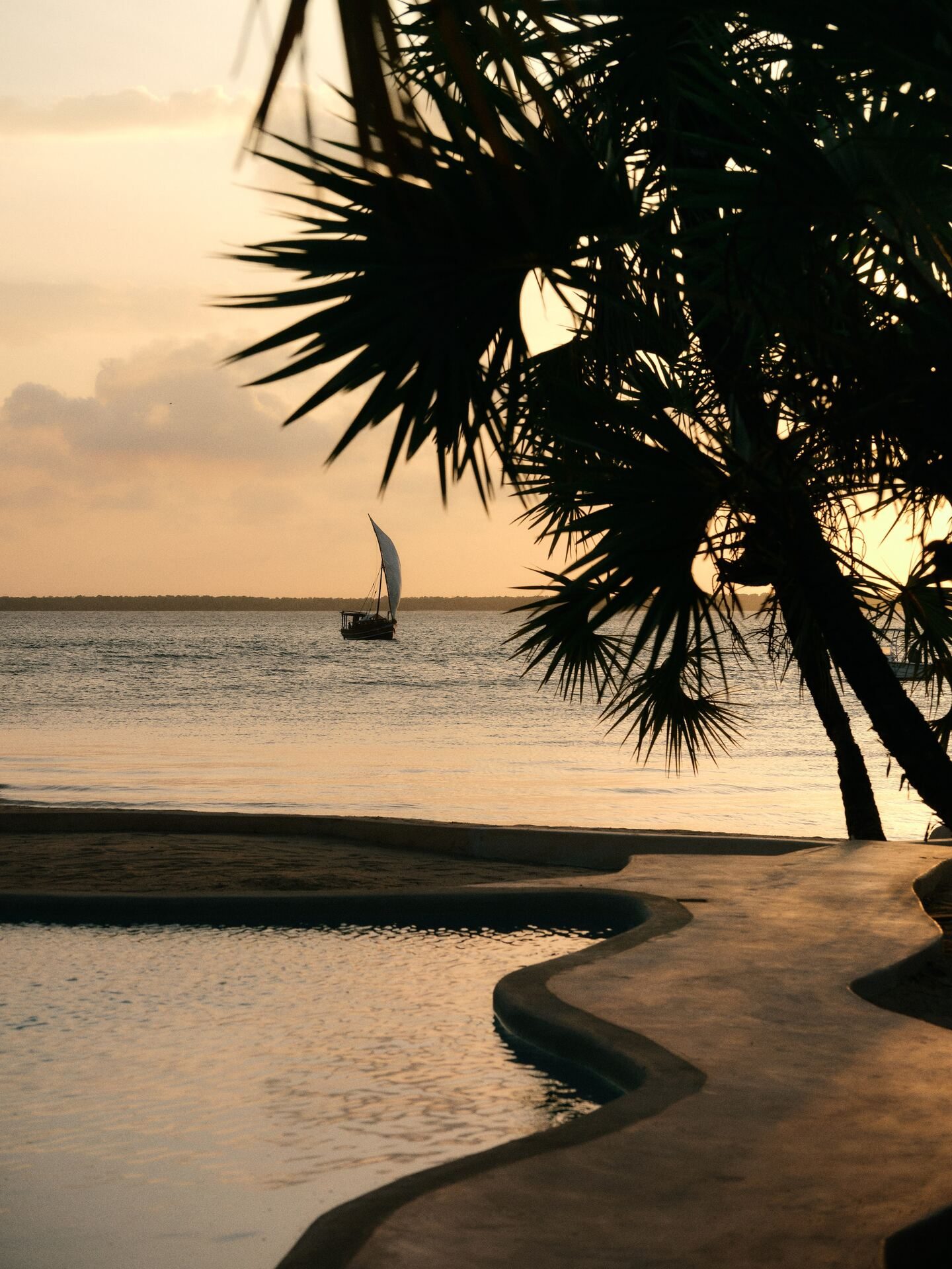 The dhow Kilindini sailing at sunset off Kizingoni Beach, Lamu