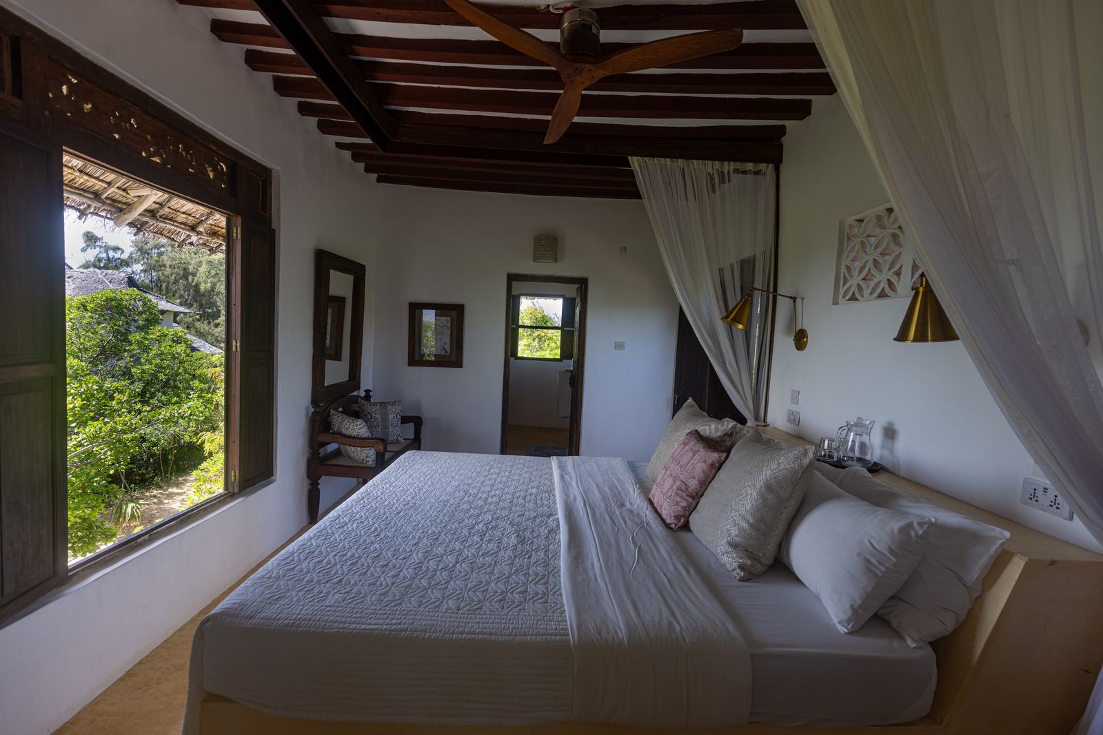 Mālama cabana — hanging swing daybed on a private terrace at golden hour